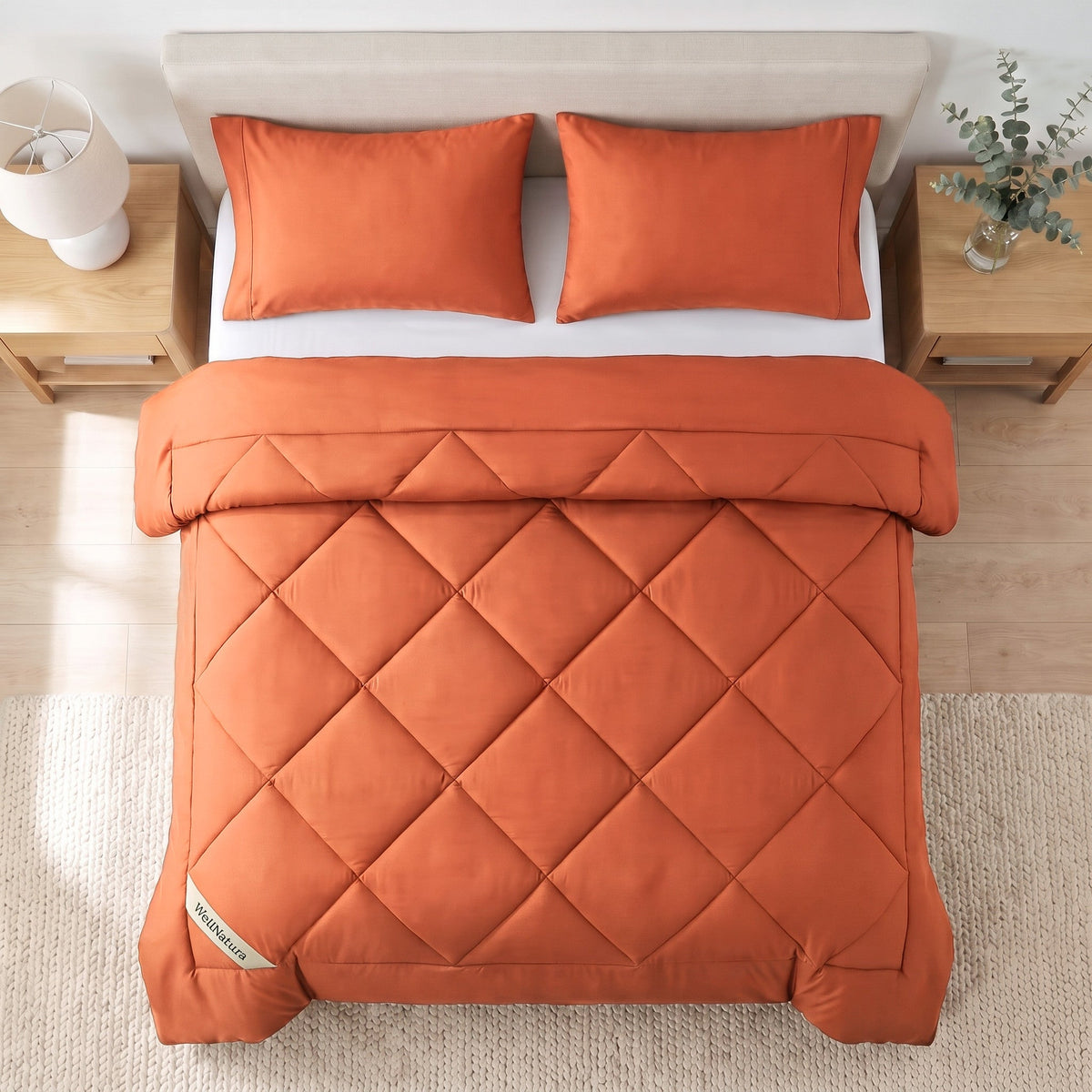 Burnt Orange WellNatura coverless duvet seen from above, big diamond quilting and a stitched border line #Colour_Burnt Orange