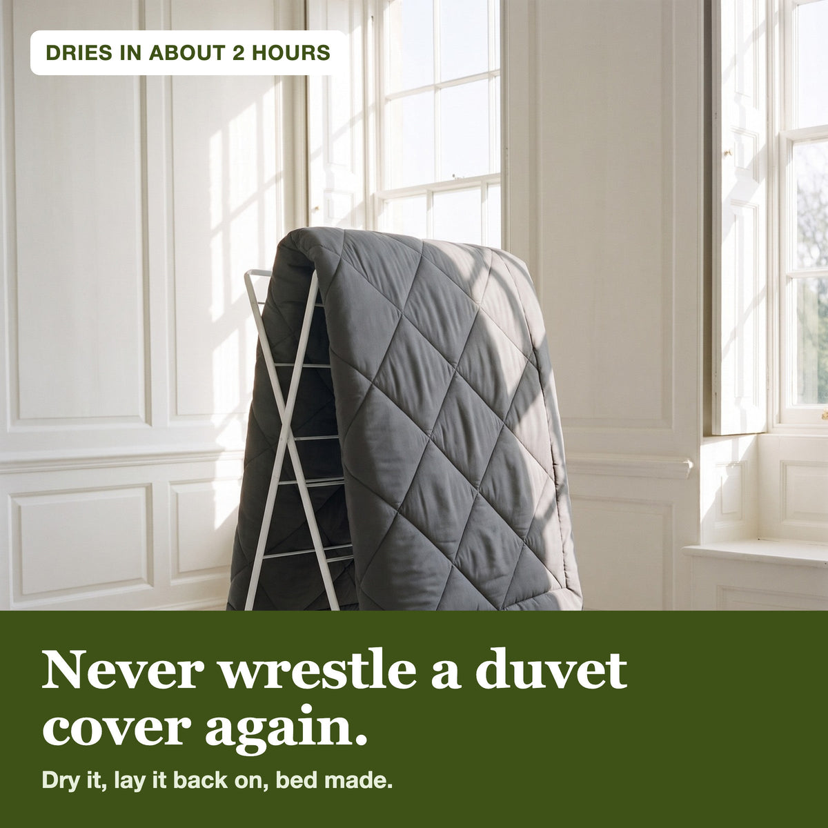 The WellNatura coverless duvet drying on an airer by a sash window
