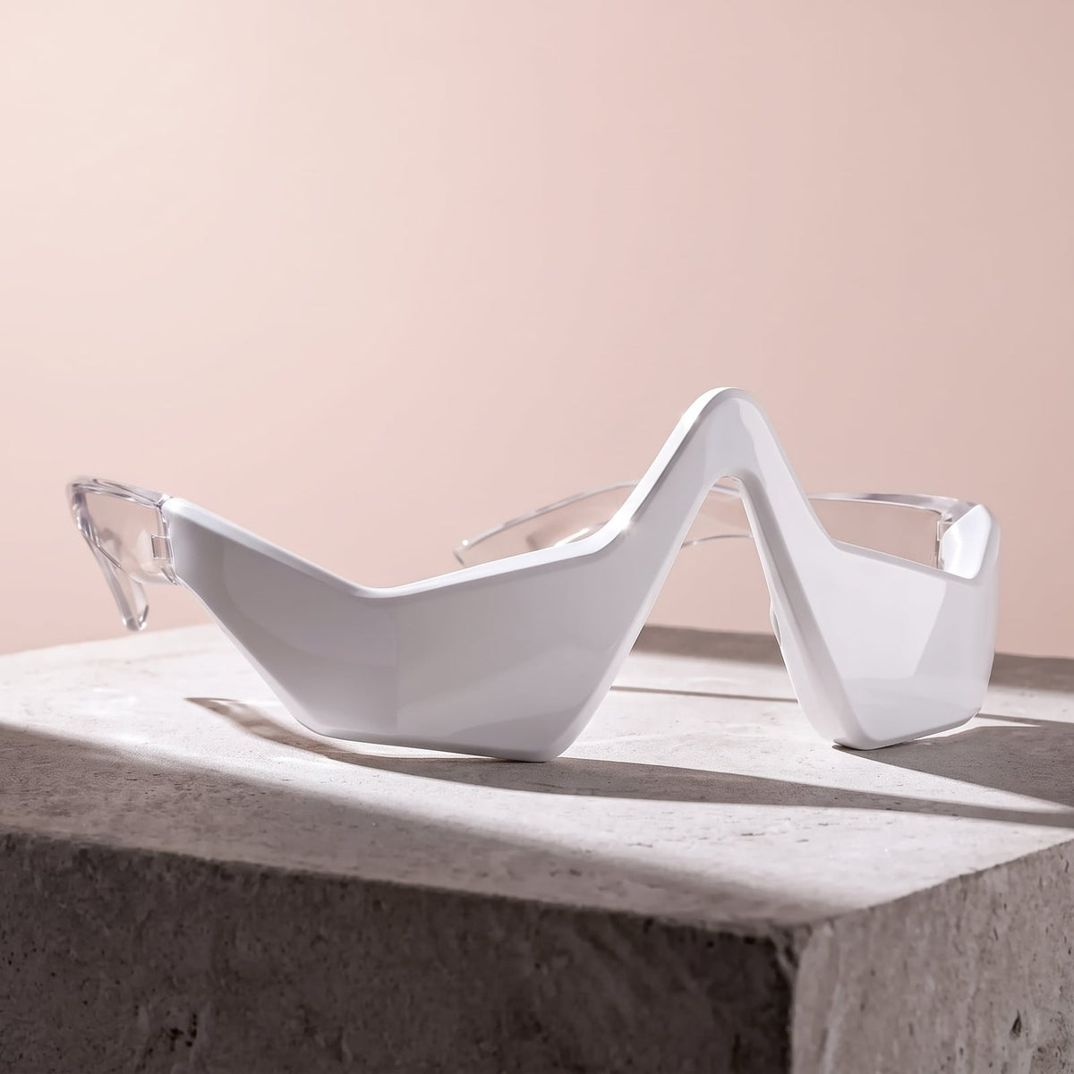 Rejuva Eyes under-eye device in white on a stone plinth