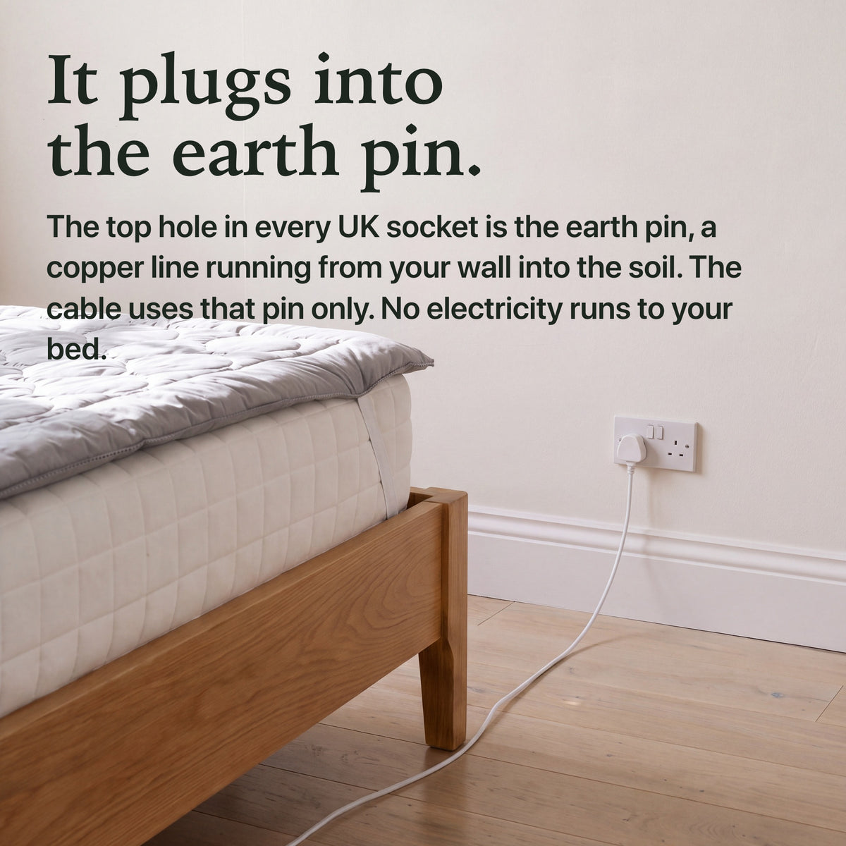 The cable plugs into the earth pin of a UK wall socket