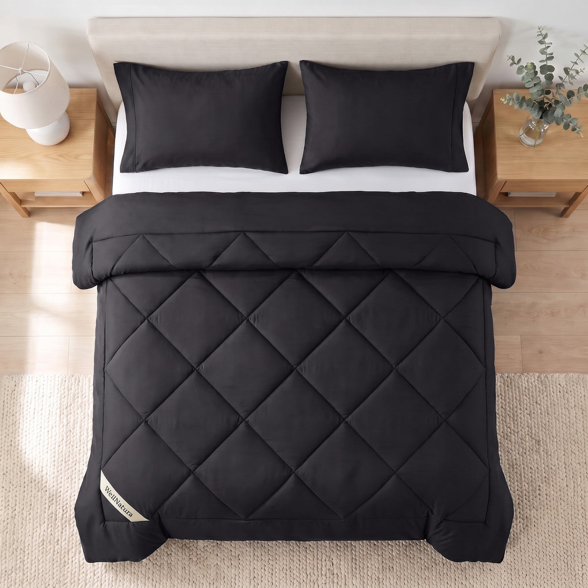 Black WellNatura coverless duvet seen from above, big diamond quilting and a stitched border line #Colour_Black
