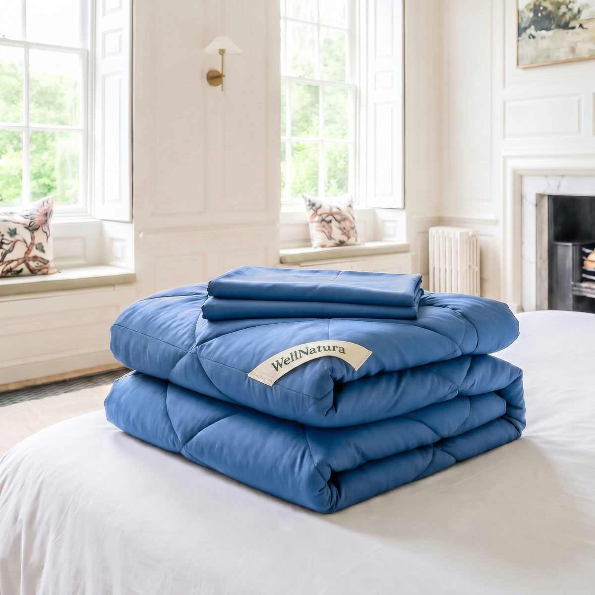 Coastal Blue WellNatura coverless duvet folded, with its two free matching pillowcases on top #Colour_Coastal Blue