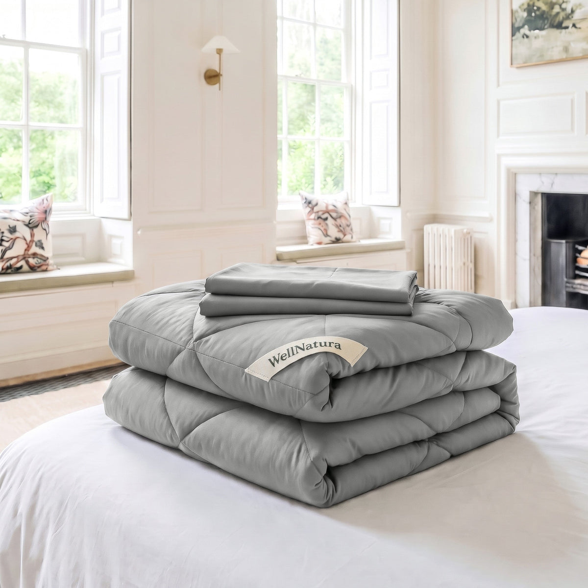 Soft Grey WellNatura coverless duvet folded, with its two free matching pillowcases on top #Colour_Soft Grey