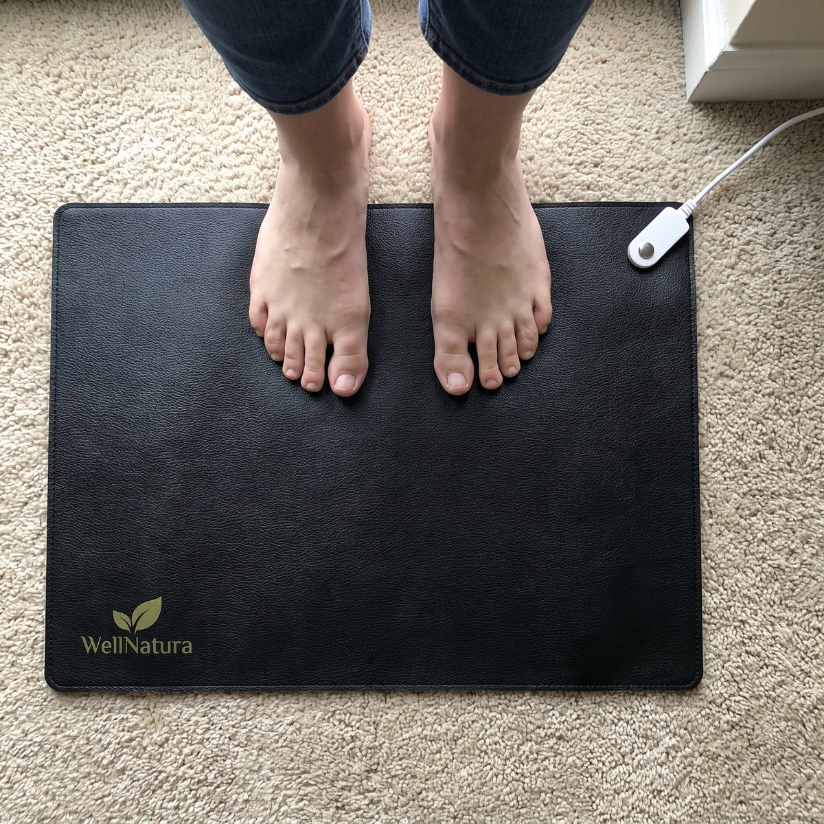 Customer view looking down at bare feet on the grounding mat